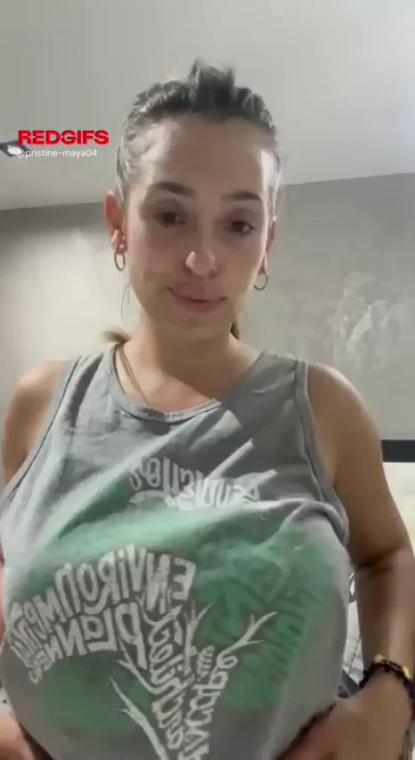 Epic Titty Drop: Massive Melons Burst Free from Grey Tank