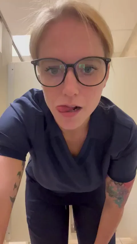 Thick Nurse MILF Flashes Massive Tits in Bathroom Break