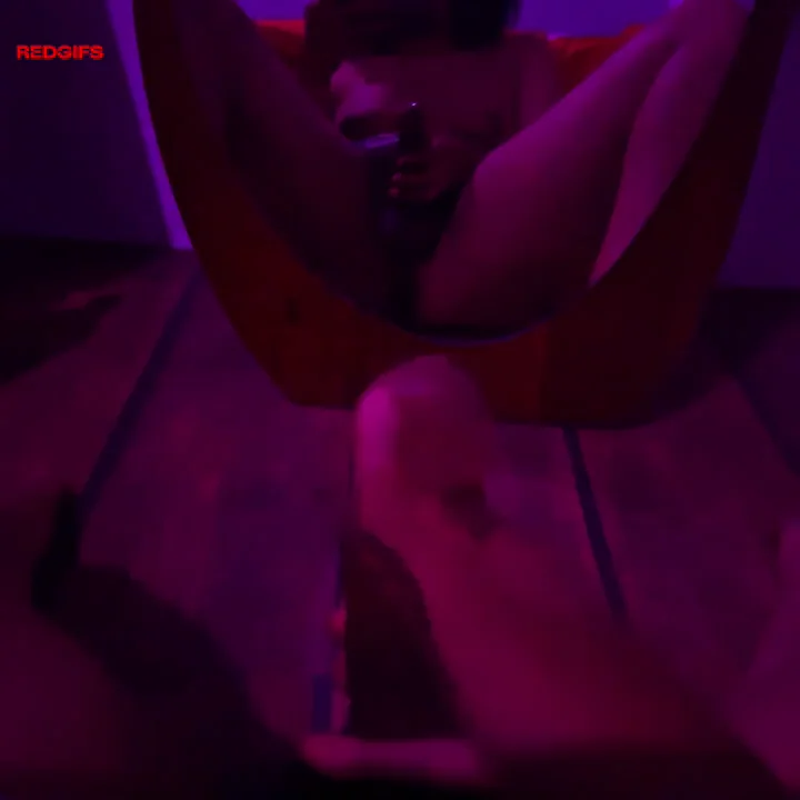 Trans Goonette Pinches Nipple While Rubbing Her Cock in Purple Glow