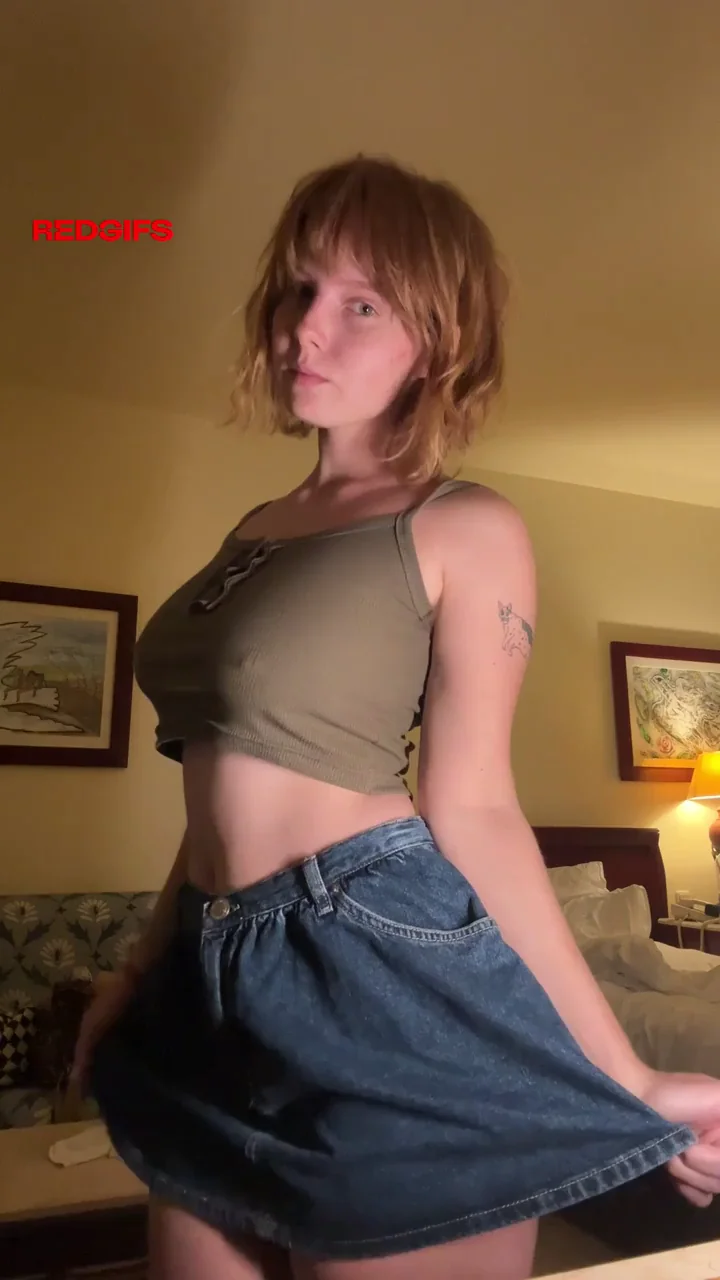 Redhead college girl undresses