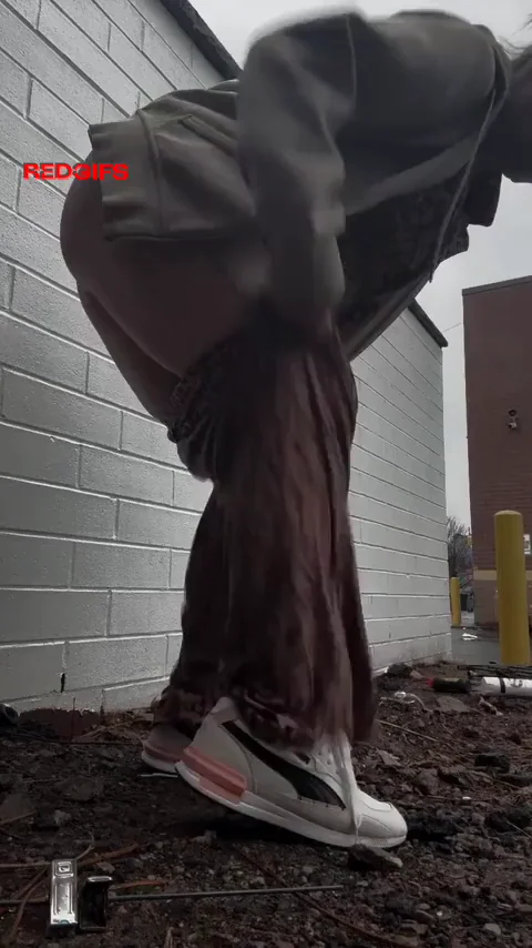 Peeing behind a dumpster