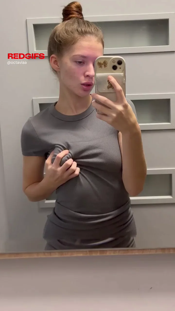 Redhead Cutie Teases Her Perky Small Tits in Mirror Flash