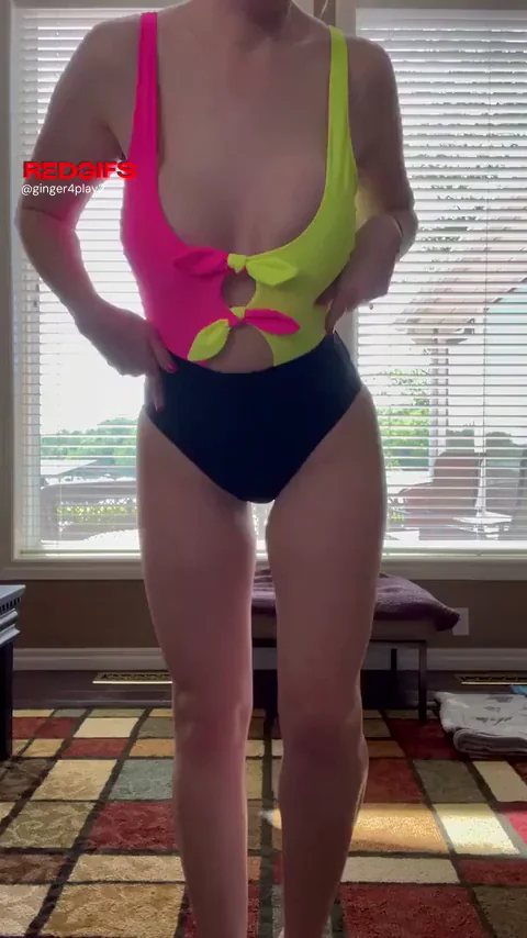 Ginger Hotwife Teases with Massive Tits Slipping Out of Neon Swimsuit
