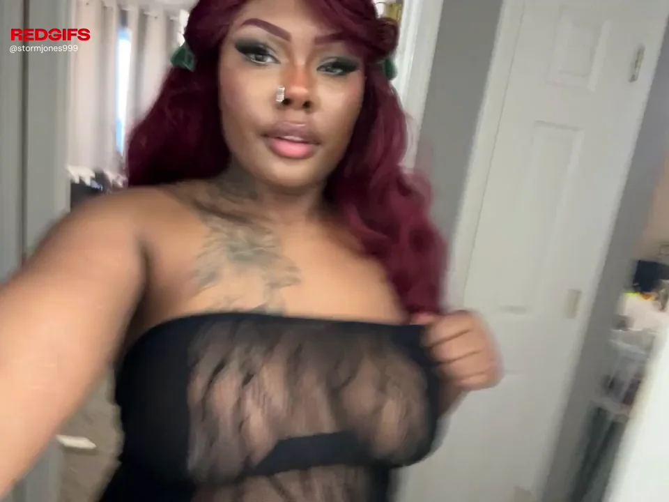 Red-Haired Ebony Bombshell Teases Her Massive Tits in Sheer Black