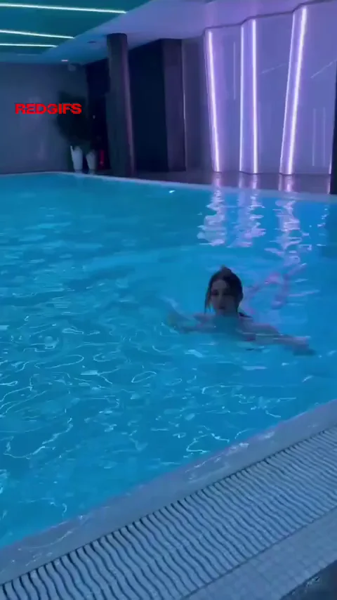 Poolside Tit Slip: Busty Babe Flashes Fake Rack in Public Pool