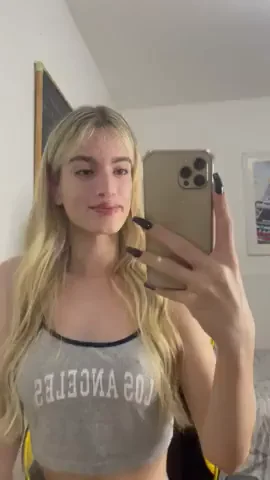 She lets her aura arrive before her words