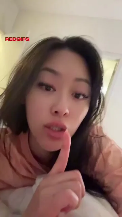 Thicc Asian Bombshell Teases with Juicy Lips and Shh Finger