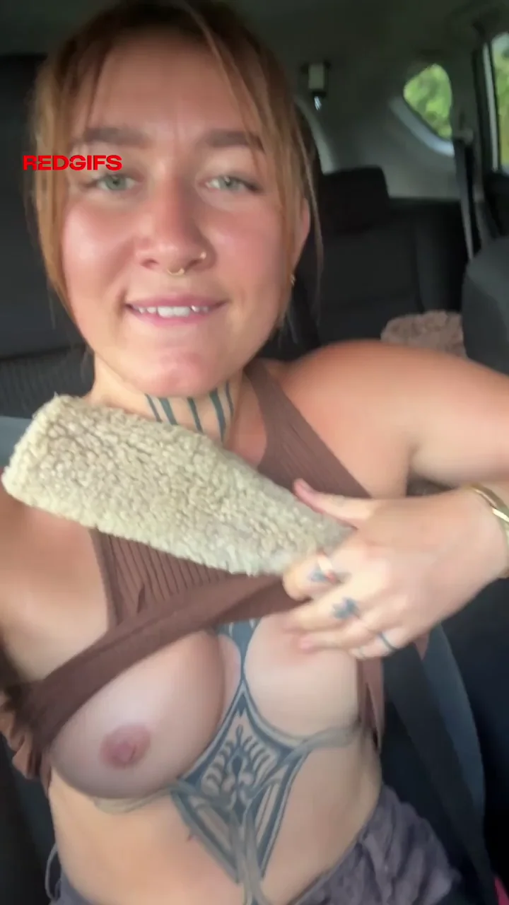 Hands on the wheel, boobs out...