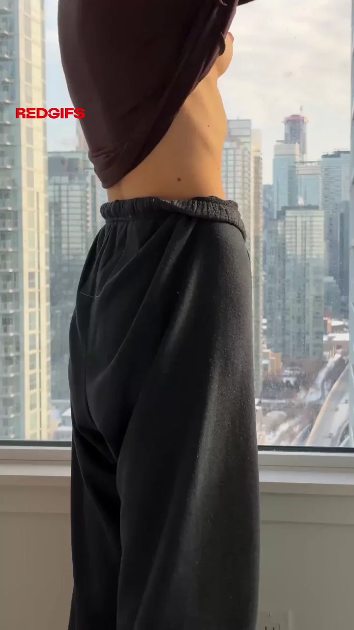 Sunday Morning Tease: Petite Slut Drops Top for City View Tit Flash
