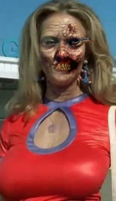 Zombie Kelly Preston's Cleavage Torched in Shiny Red Latex