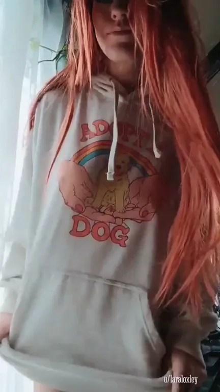 Redhead Hoodie Slut Unveils Her Massive Bolted-On Tits