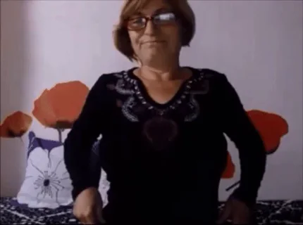 54-yr Old Strong European Woman Removes Her Top
