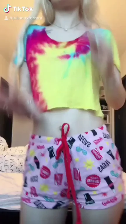 Front View Tease: Blonde Bombshell's Perky Tits & Thong Drip in TikTok Glow