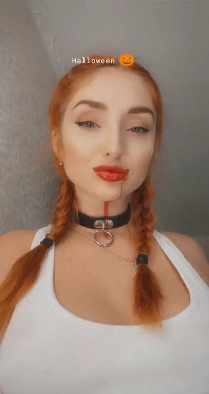 Redhead Halloween Slut Teases with Choker Lips and Titties