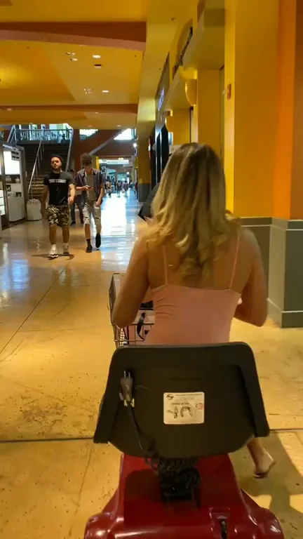 Blonde Slut Bends Over on Scooter, Flashing Juicy Ass in Mall