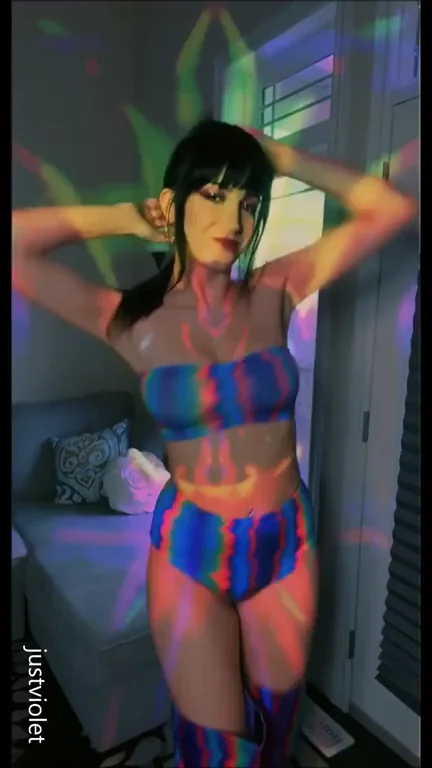 Naughty Go-Go Dancer Teasing in Psychedelic Bikini