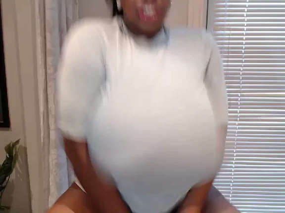 African Busty Bombshell: Saggy Ebony Tits Tease in White Sweater & Corset