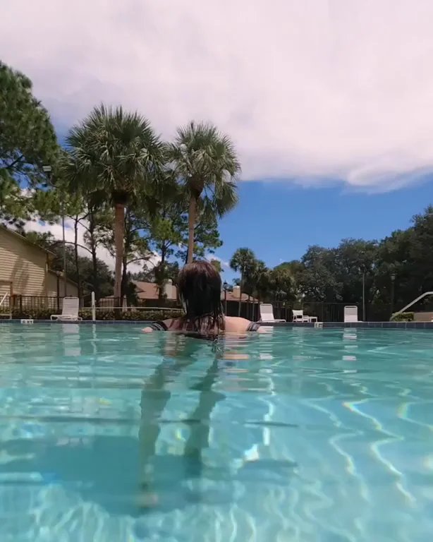 Poolside Tease: Busty Babe Flashes Tits, Hooks Neighbors Through Open Windows