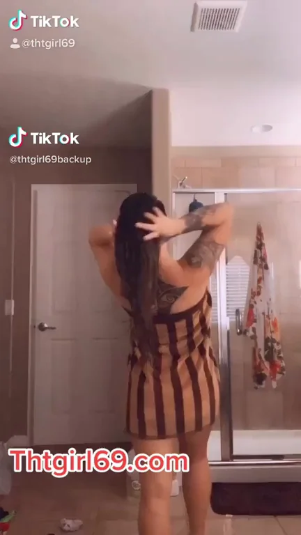 Latina Tease Dances in Striped Dress, Begs You to Introduce Yourself