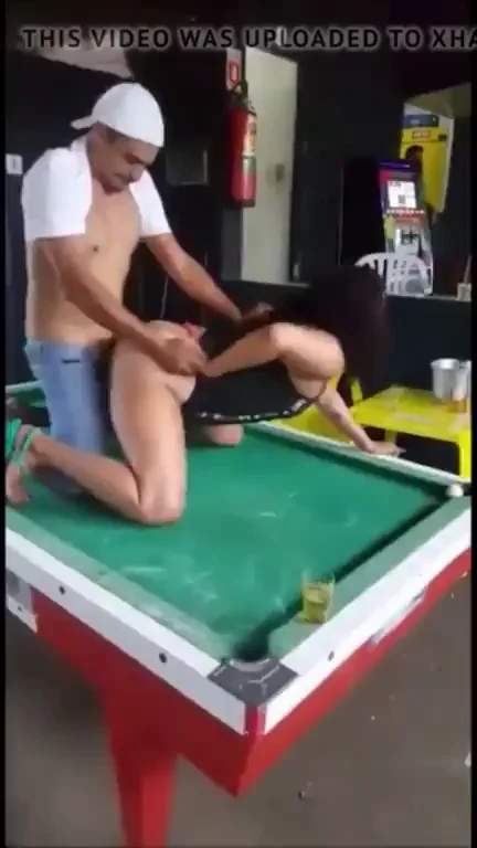 Dude fucking on a pool table at a party