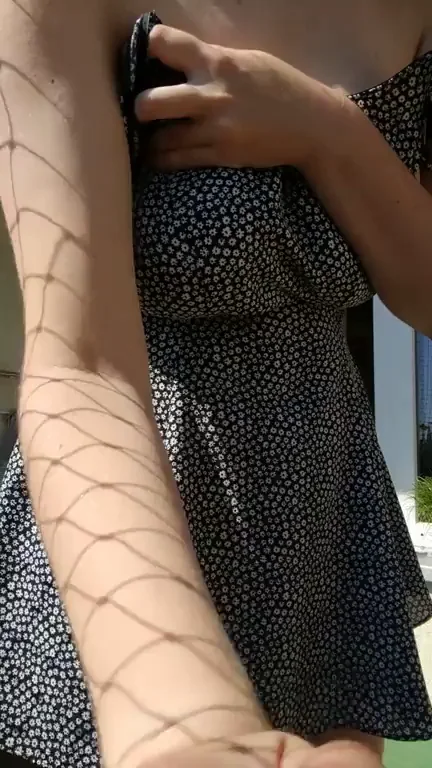 Sundress reveal on the balcony