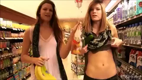 Twin Sluts Flashing Juicy Tits in Grocery Store with Banana Scale