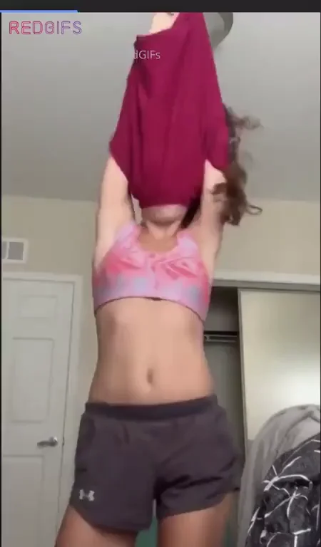 Slutty Tease Stripping Off Her Top and Shaking Tits