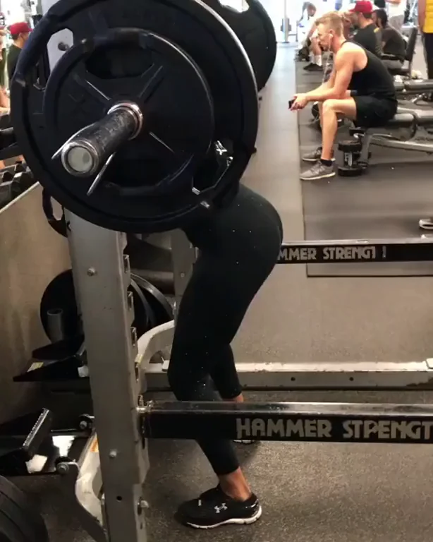 Former WWE wrestler Cameron (a.k.a. Ariane Andrew) squatting