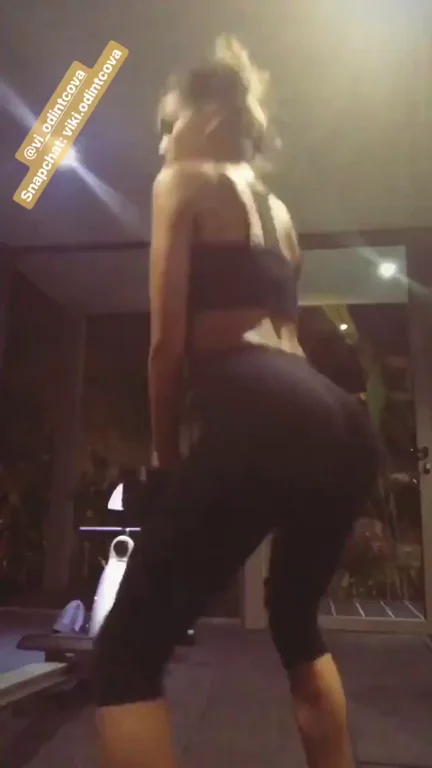 Model Viki Odintcova squatting