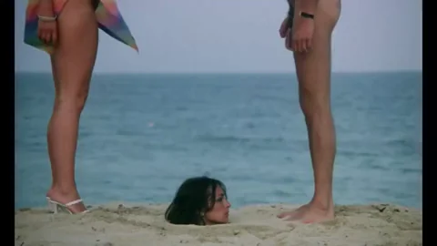 Facial while buried on the beach ( 1981 )