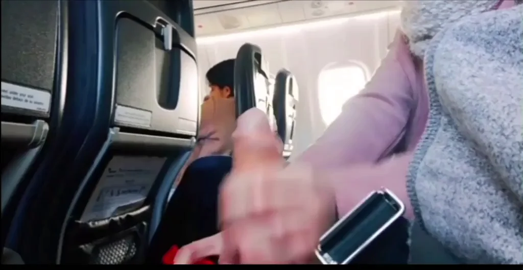 Giving a handjob while people sitting next to us on an airplane ?