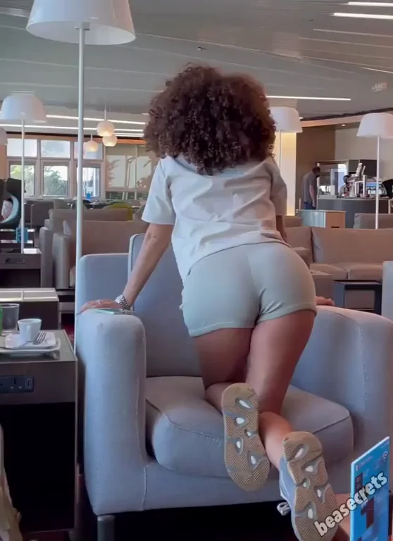 Curly Haired Slut Teases Ass in Hotel Lounge, Begging You to Rip Off Her Shorts 😈🍑