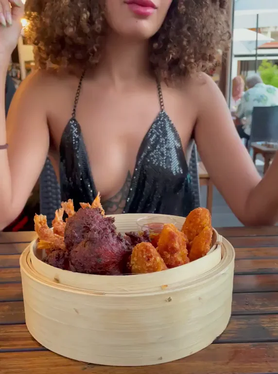 Curly-Haired Vixen Teases in Public: 'What Would You Do If You Saw Me Eating?'