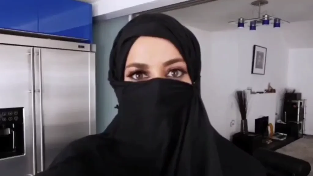 Arabian wife teasing herself and fanning with tourist when her husband out of home