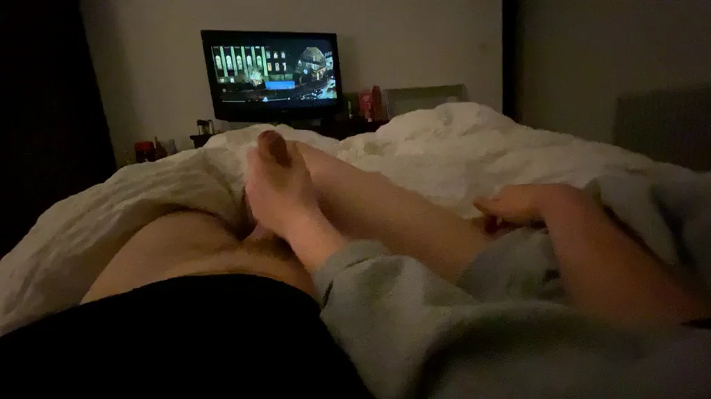 Playing with each other ignoring the movie playing in the background