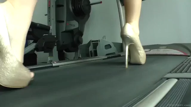 On a treadmill wearing heels and a dirndl