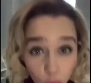 Emilia Clarke looking up at you while giving you a slow sensual blowjob