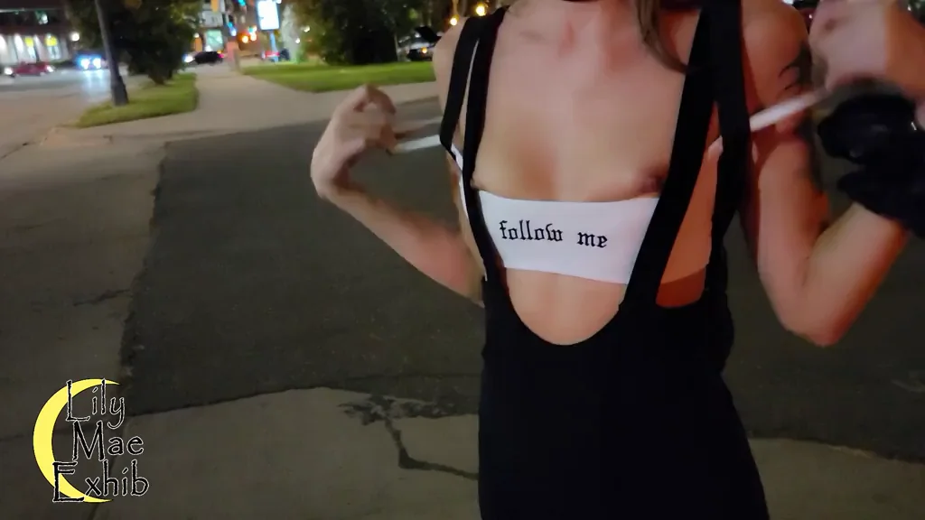 My husband got me to take my top completely off in the middle of busy downtown! I was so nervous...and turned on! [GIF]