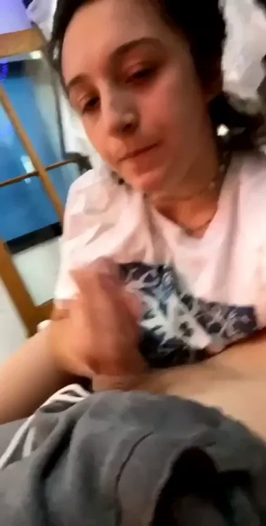 Jerks him on to her tits