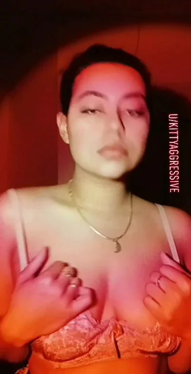 Edgy Ebony Babe Teasing Tits in Red Glow 🔥🍑