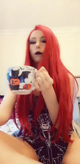 Goth Slut with Fiery Red Hair Greets You Naughtily