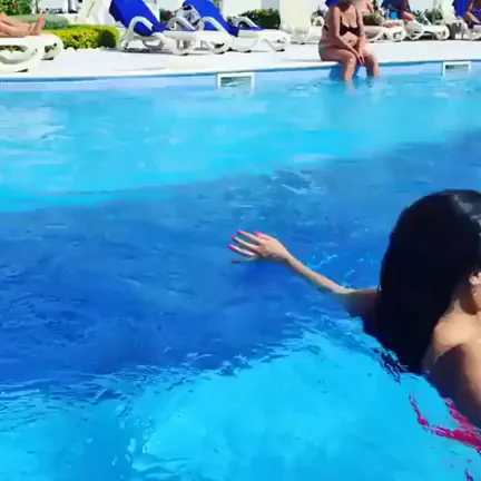 Busty Slut Splashing Her Massive Tits in the Pool