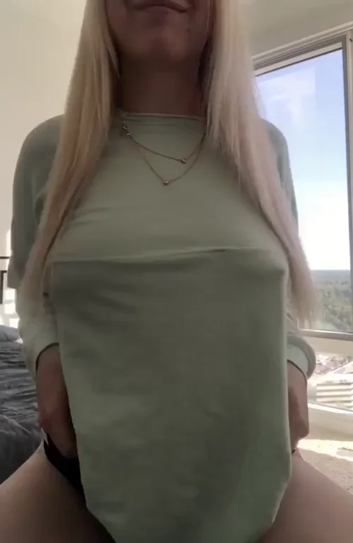 Blonde Bombshell's Teasing Titty Tuesday Flash – Not So Small After All!