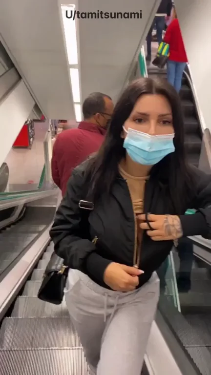 Slutty Boobs Busting Out on Public Escalator Tease