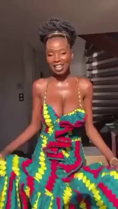 Radiant African Ebony Babe Teasing Massive Tits in Sexy Dress 🔥🍫