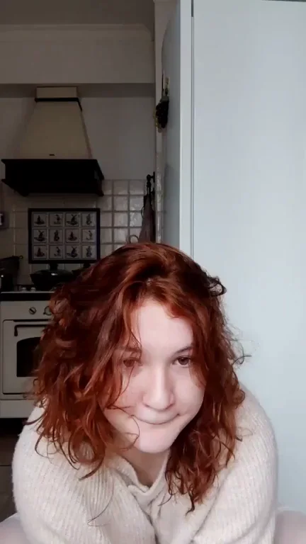Redhead Kitchen Slut Bounces Her Massive Tits in Sweater Tease