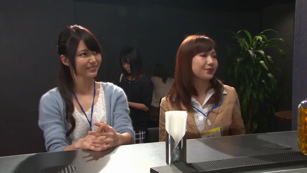 2 coworkers share a quiet drink