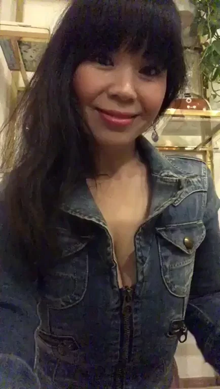 Asian MILF Flashes Massive Tits in Open Denim Jacket