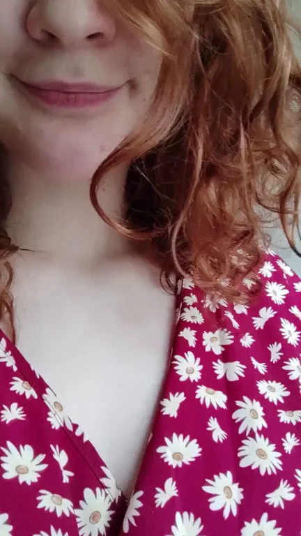 I hope a sexy redhead with nice natural boobs is what you need to brighten your day