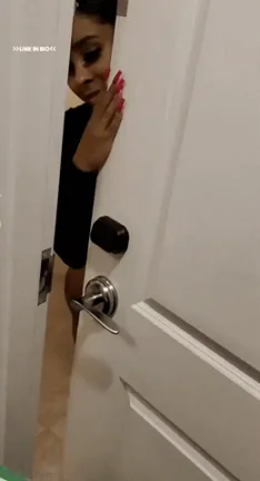 Redbone hottie with booty tattoo answering the door